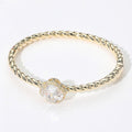 CZ Quatrefoil Stone Accented Twisted Hinged Bangle Bracelet